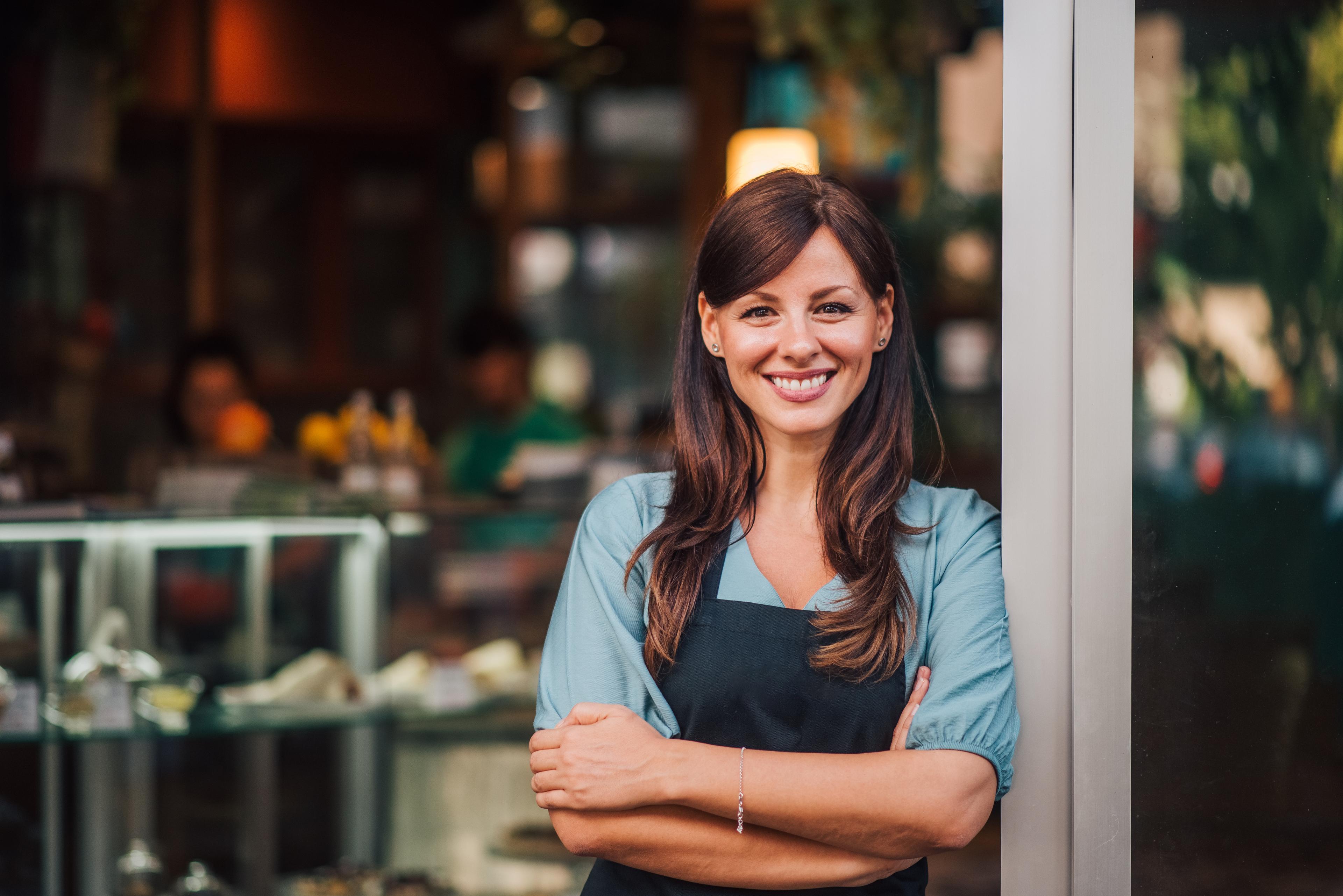 woman standing outside of restaurant